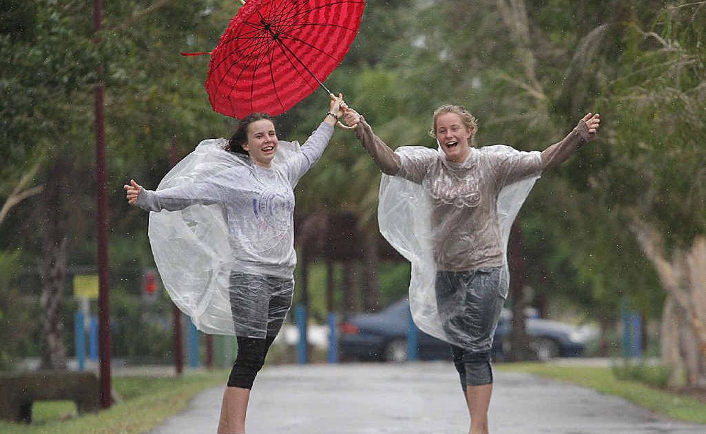 You only live once say Hervey Bay teenagers Sharon Raittila, 15, and Liss Bradley, 16, as they refused to let the wild weather disrupt their day during the wet spell. You only live once say Hervey Bay teenagers Sharon Raittila, 15, and Liss Bradley, 16, as they refused to let the wild weather disrupt their day during the wet spell.